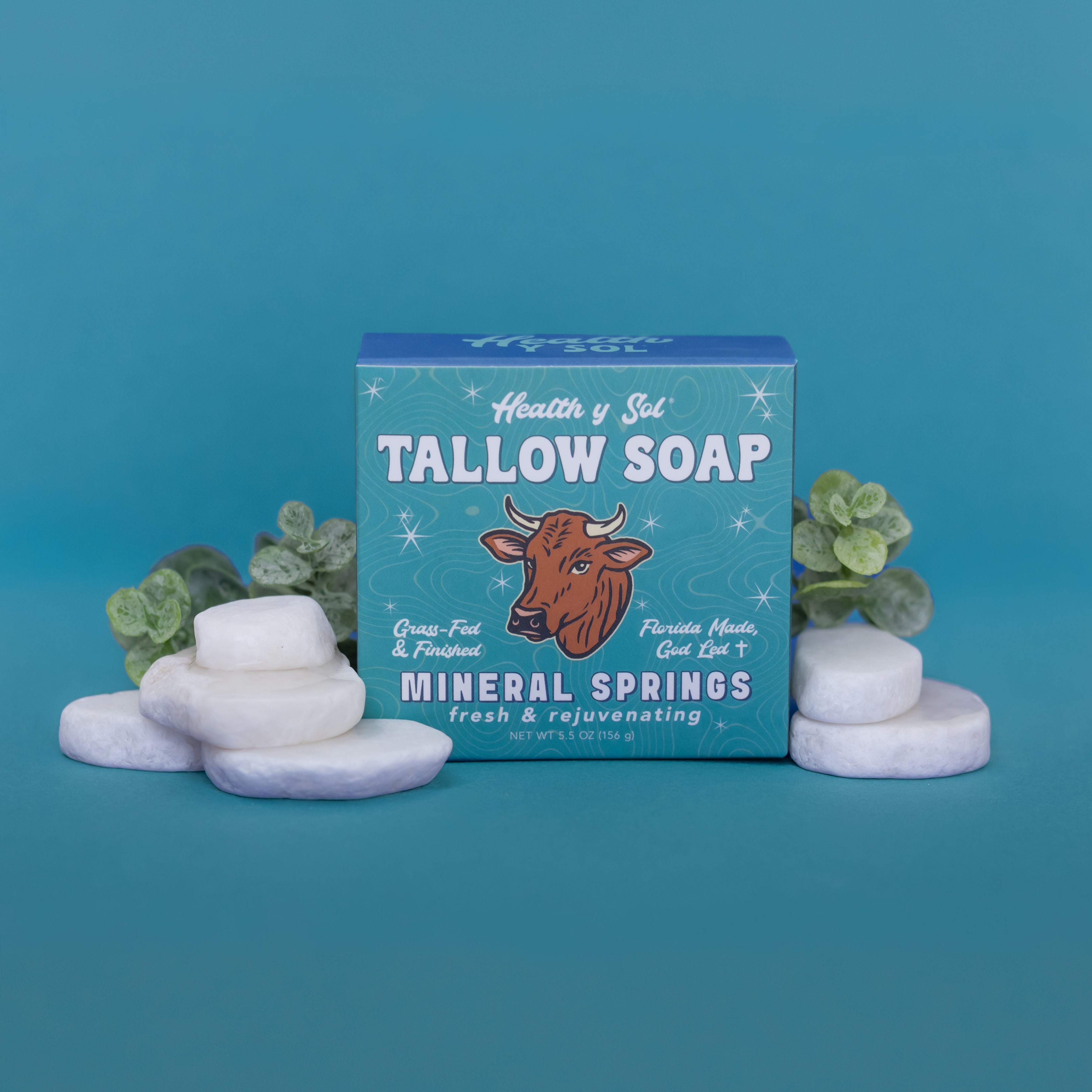 picture of bar soap with rocks on blue background