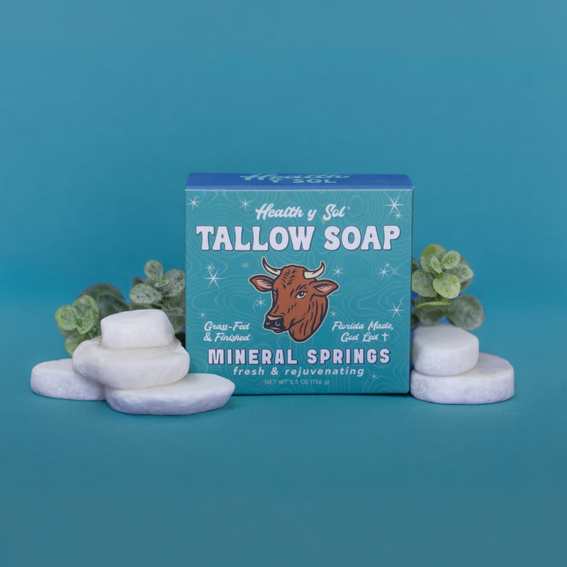 picture of bar soap with rocks on blue background